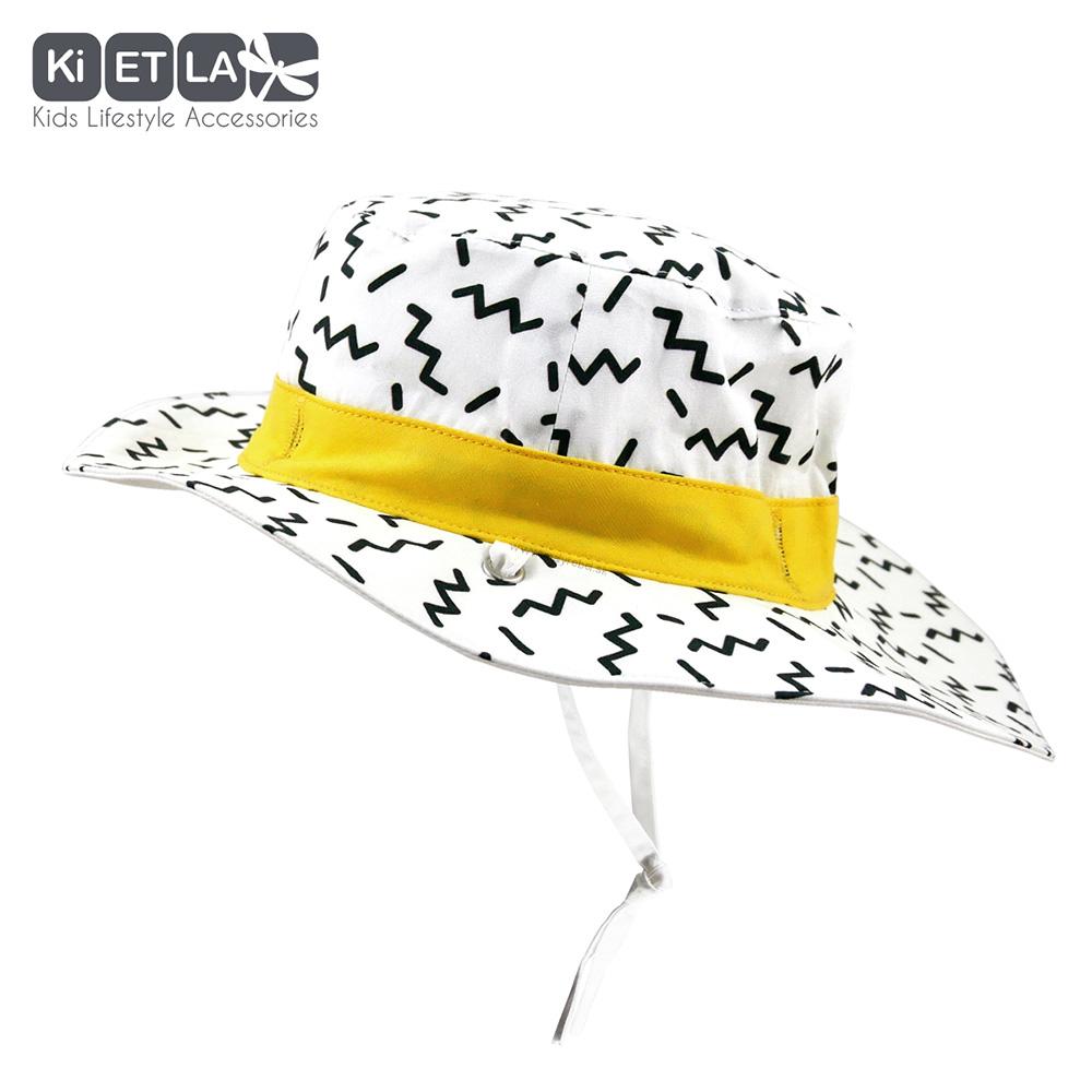 KiETLA obojstranný klobúčik s UV ochranou-zigzag žltá-skladom